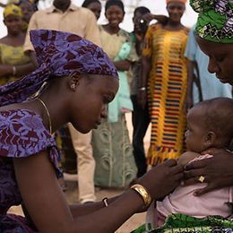 African women caring for a baby