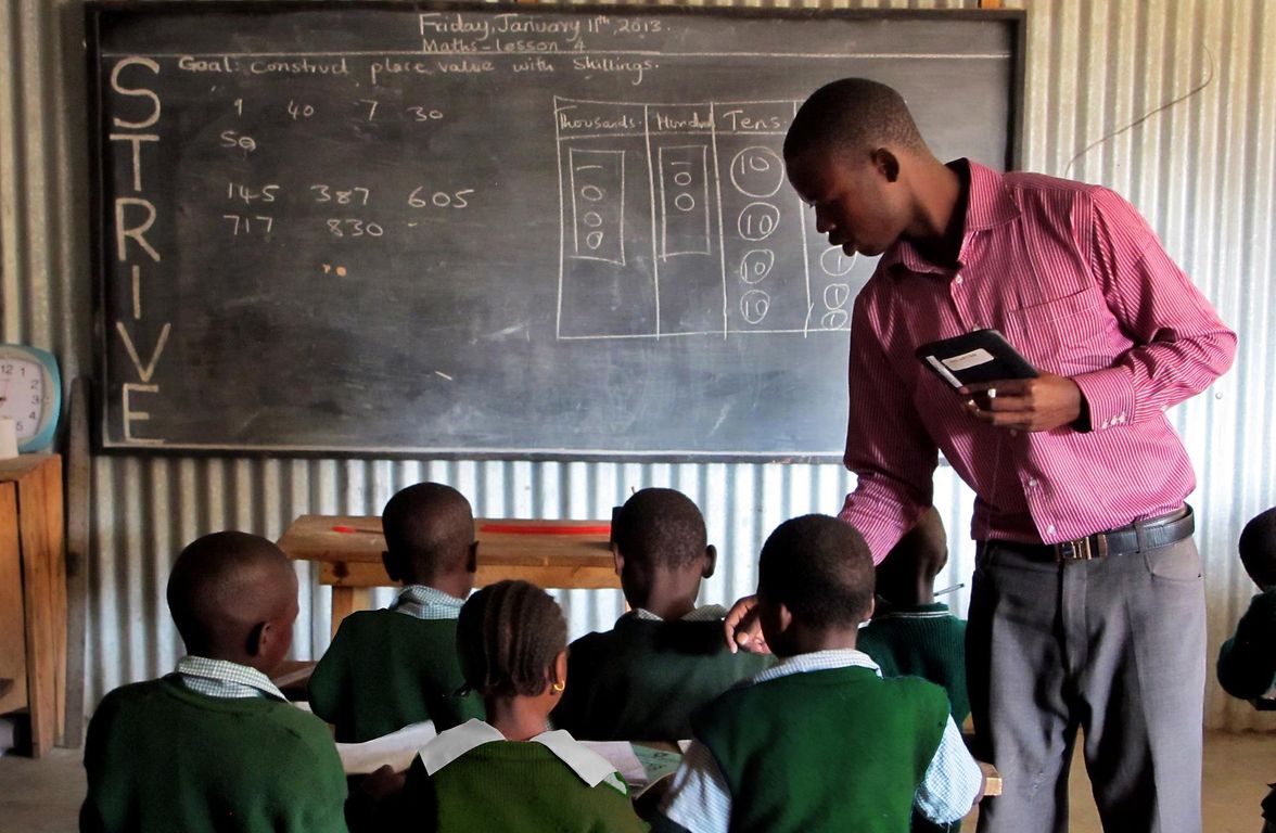 BIA, Teacher with students in classroom